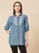 MID WASH DENIM LONGLINE SHIRT WITH INTRICATE LACE LIKE EMBROIDERY
